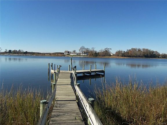 Sitting on the dock of the creek.