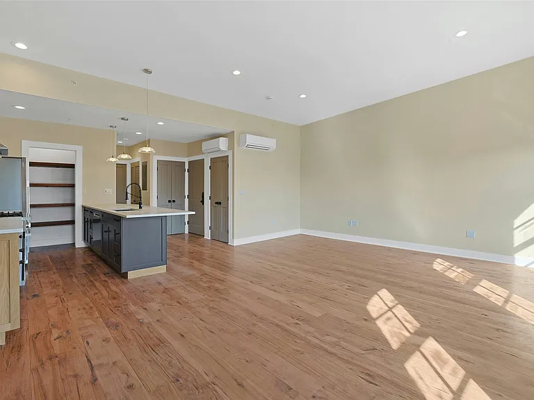 Dining, living, and kitchen areas.