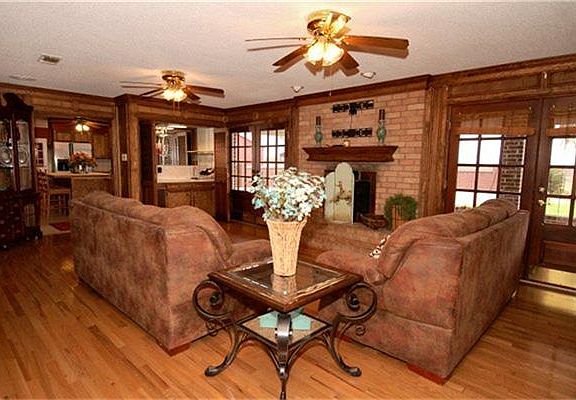 There are several living areas in this house. This is a view of the family room. Notice the hardwood