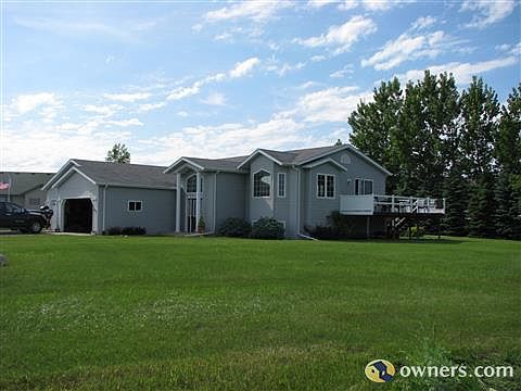 Front of house with 3 stall garage