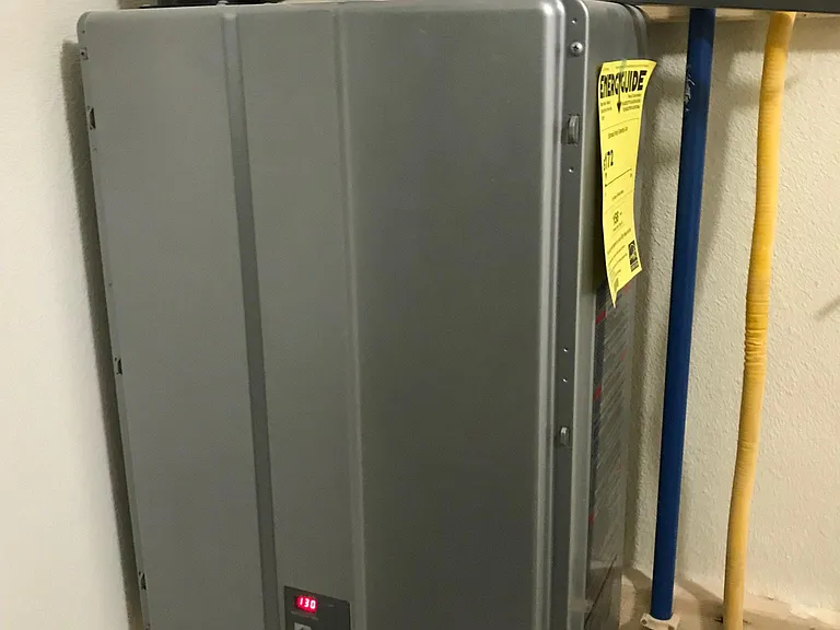 Tankless water heater. You can run your dishwasher, washer and all three showers and bath at the same time and you won't run out of hot water.