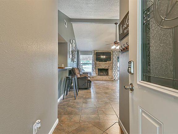 A welcoming foyer leading to the living room