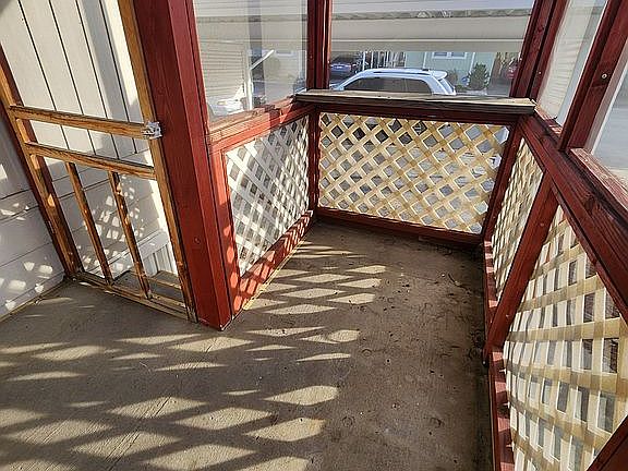 Screened front porch area