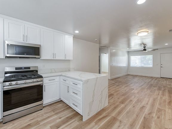 Luxury Kitchen & Appliances, LVP Flooring, Dual Pane Windows, Ceiling Fans, TV Mount.