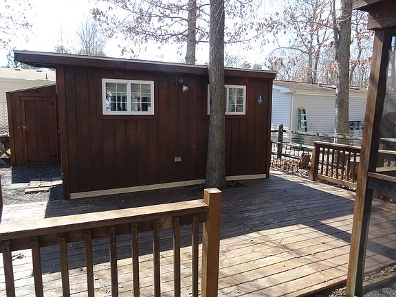 Large rear shed with deck