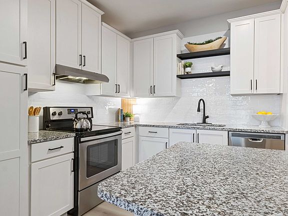 Stainless steel appliances and granite countertops