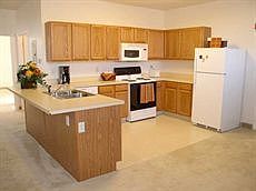 Supersized kitchens with upscale appliances including dishwashers, built-in microwaves, electric stoves and frost-free refrigerators.
