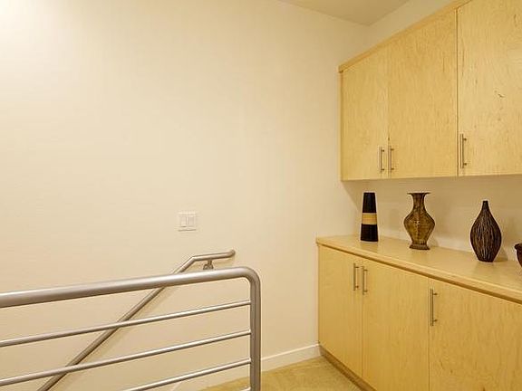 Top of third floor, ample storage (stock photo from when purchased)