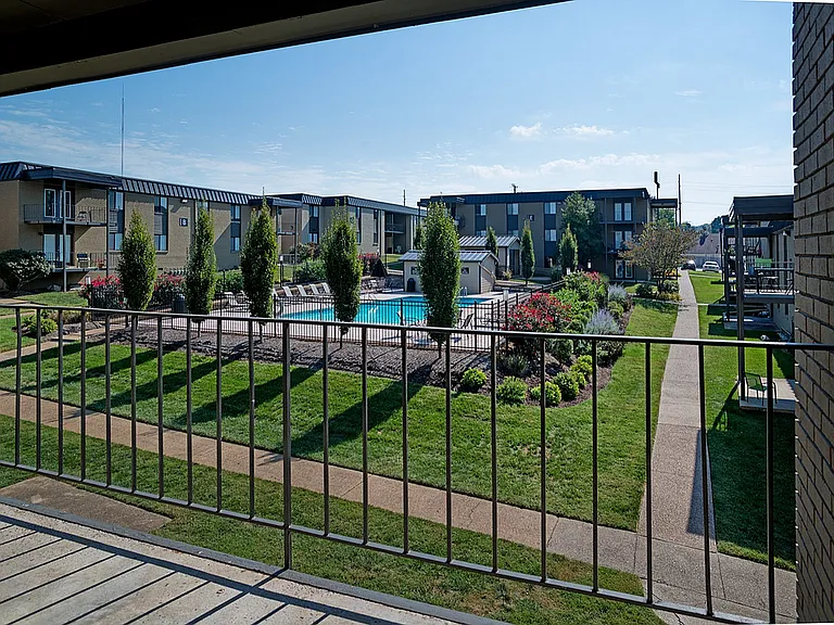 Experience tranquil living with views of beautiful gardens and a refreshing pool.