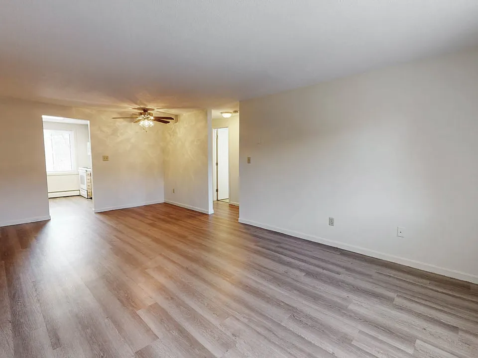 Bright Living room and dining area with Luxury vinyl plank flooring giving a modern designer look and feel.