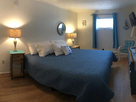 Master bedroom with walk in closet and king size bed