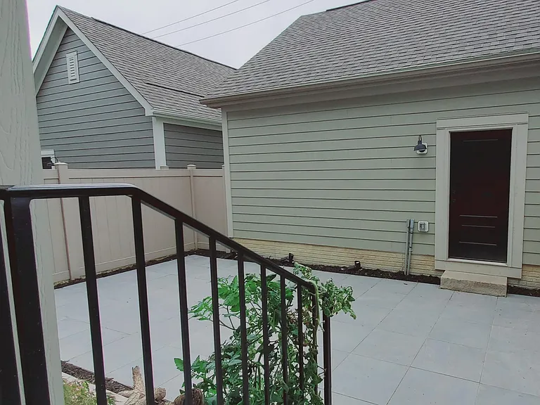 Newly paved back yard, garage