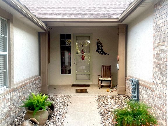 Welcome home with a small water feature among the maintenance free rocks.