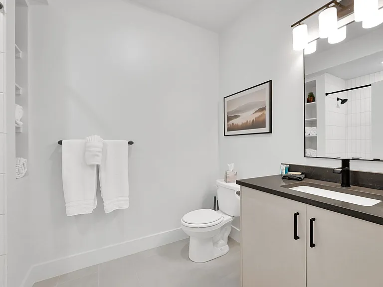 Downstairs hallway bathroom with tub