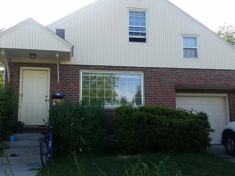 Exterior with garage to the right.