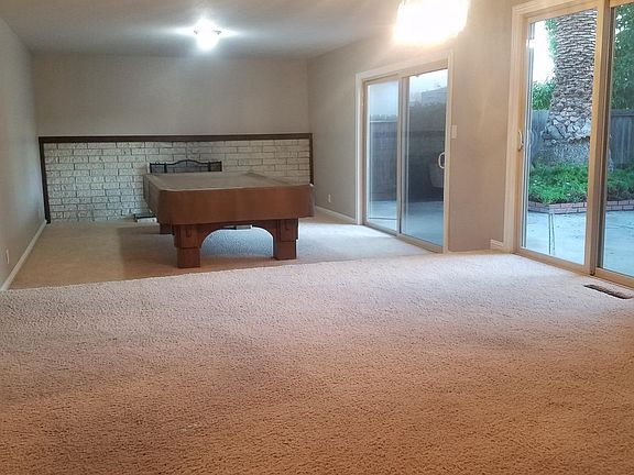 Standing in Dining Room looking at Step-down Living Room
