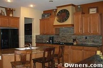 Beautiful Granite Kitchen with Custom Stone Backsplash