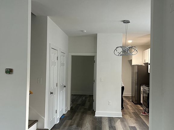 Front living room/dining room, downstairs en-suite bedroom, plus powder room and kitchen