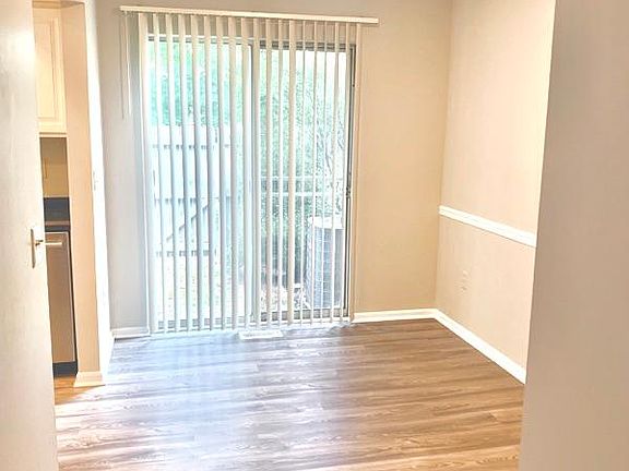 Open eating area off kitchen, with slider door to your private patio.