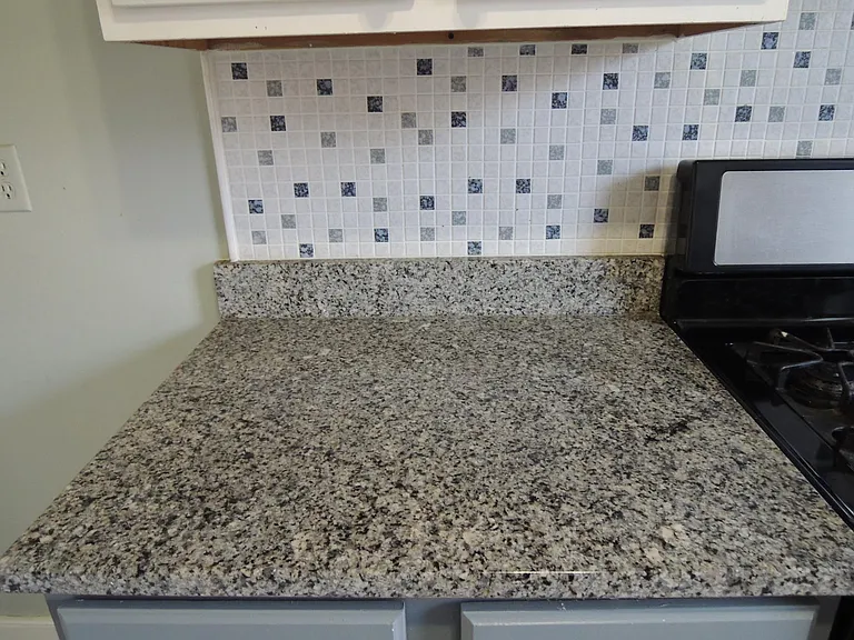Granite counters, tile backsplash