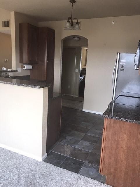 Entering kitchen from living area. Lots and lots of storage in kitchen and throughout condo.
