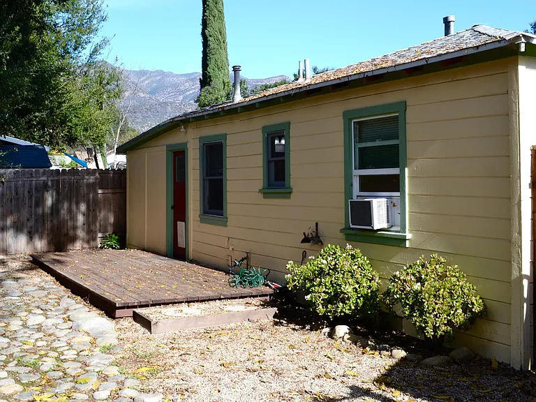 Back garden with deck & mountain view.