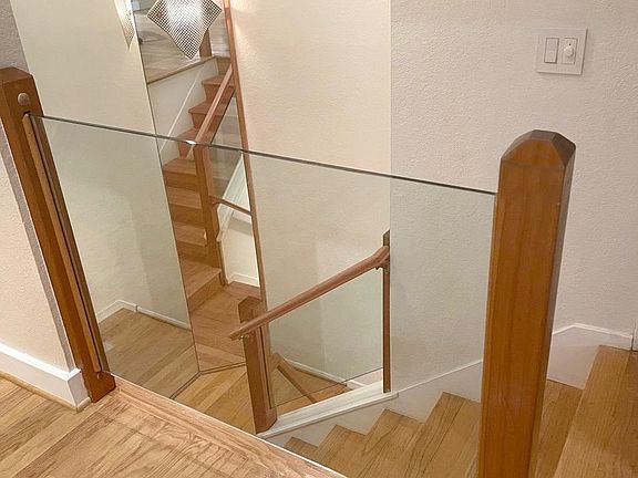 Contemporary glass and mirror staircase.
