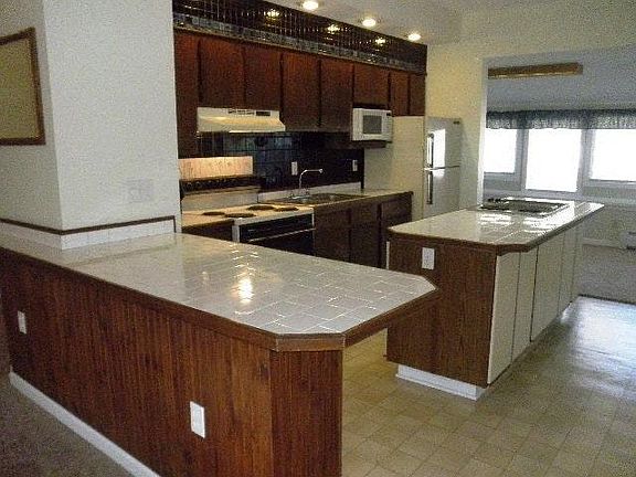 Kitchen with tiled countertop