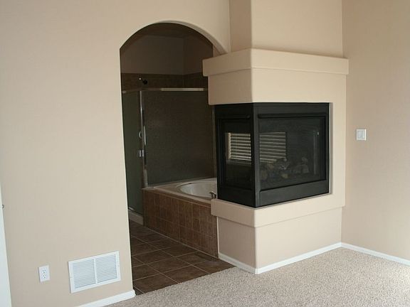 Master Bath with 3-sided Fireplace