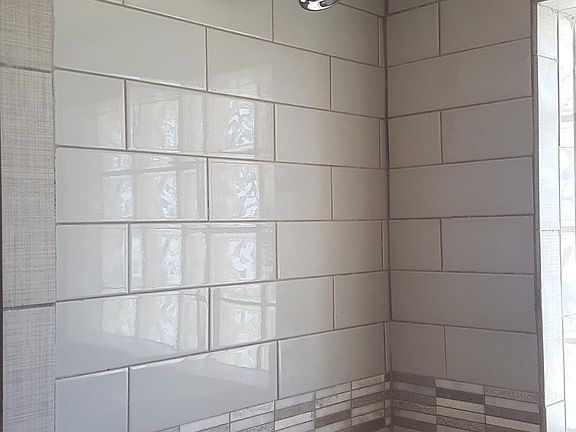 new shower head and drain and tub