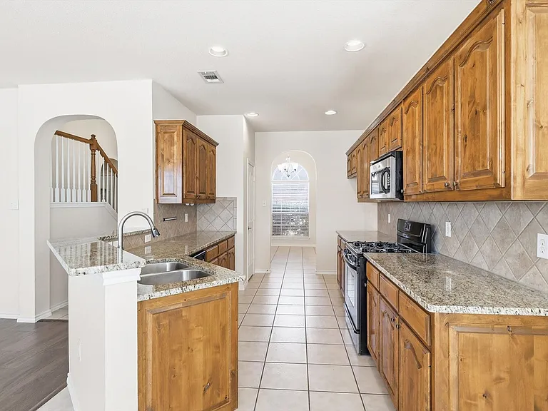 And open to family room as well. Perfect for entertainment. And with a usable breakfast bar.