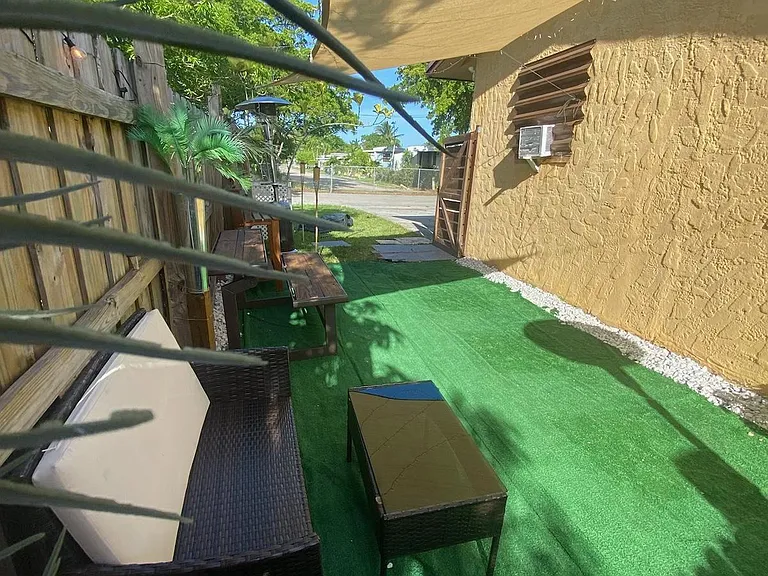 Private yard space view with gate open.