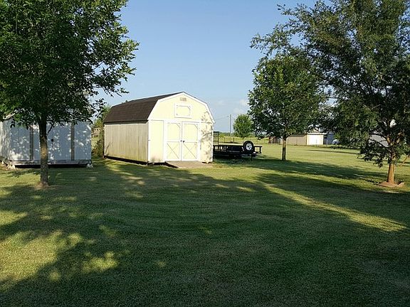 Back yard view with shed & workshop.