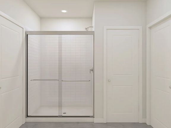 Glass shower enclosure in primary bath