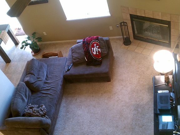 Living room with fireplace and vaulted ceilings
