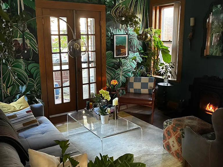 Living room with gas fireplace and access to covered front porch