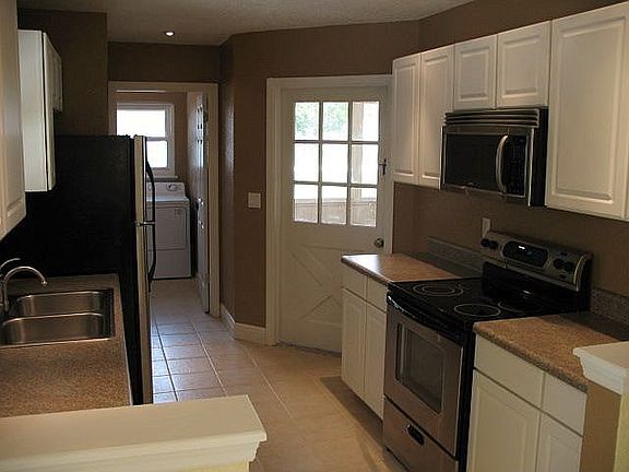 Stainless steel appliances, new floor, and cabinets