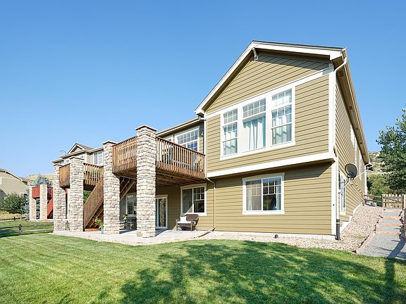 The home features a walk-out basement with lower patio.