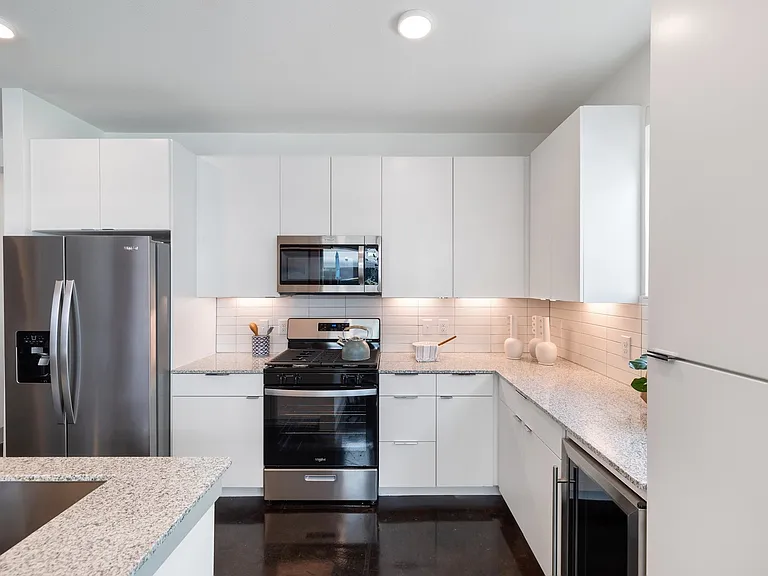 Model Kitchen with Gas Stove Top and Stainless Steel Appliances