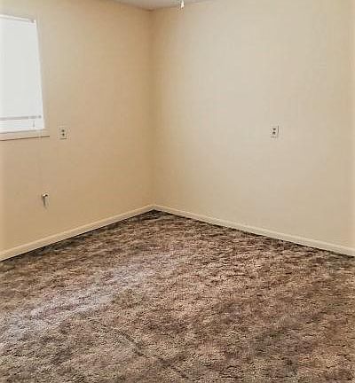 Bedroom with window view and ceiling fan