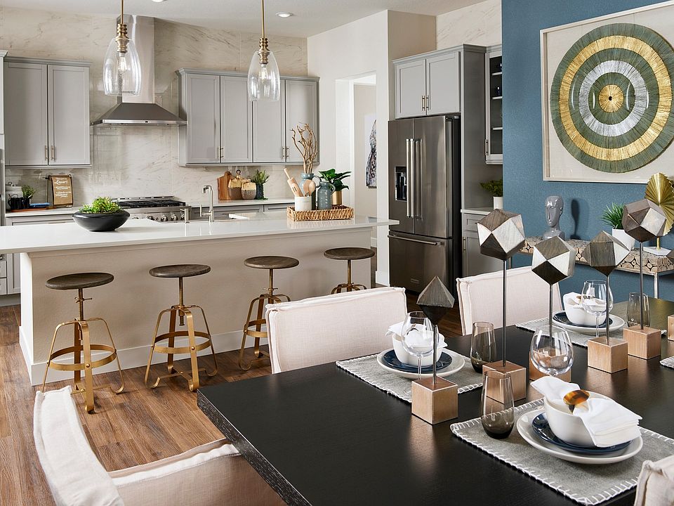 Luxurious kitchen in Trevenna features sleek cabinetry, modern decor, and a chic island design.