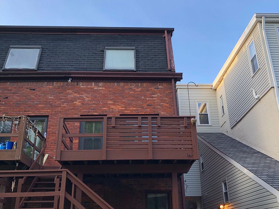 Back deck and entrance from private off- street parking area.