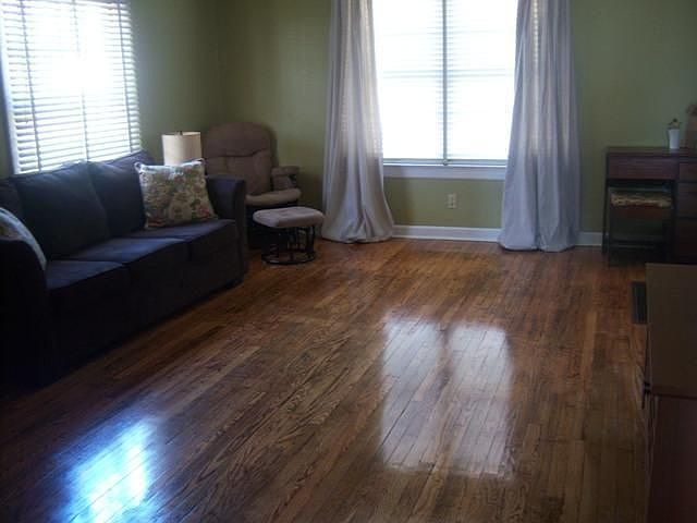 Large living room with several windows to let natural light