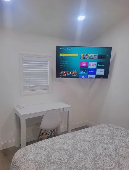 Includes closet, TV, air conditioning, and desk with chair.