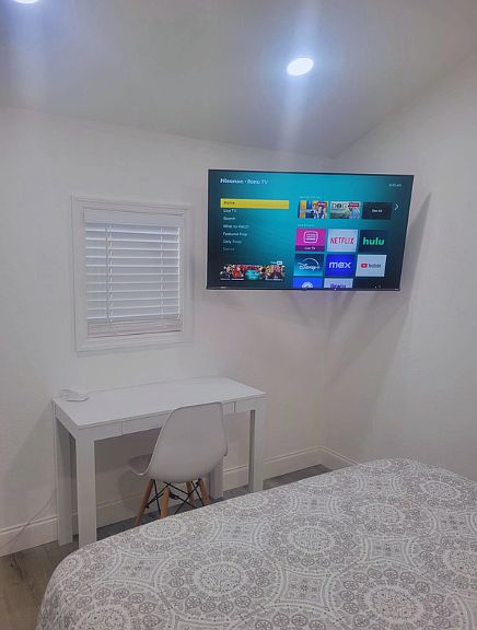 Includes closet, TV, air conditioning, and desk with chair.