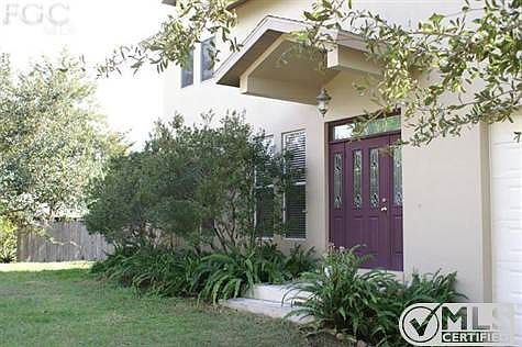 Ferns, Myrtles and Oak trees welcome you to a beautiful one of a kind home with direct gulf access.