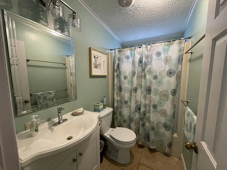 Second bathroom with shower and tub.