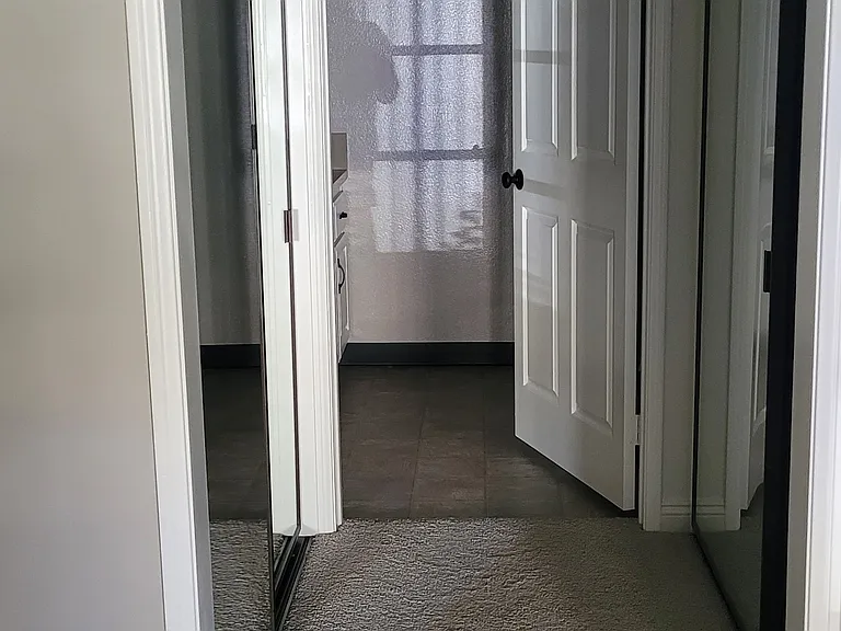 hall way closets for master bedroom, one on each side of hallway