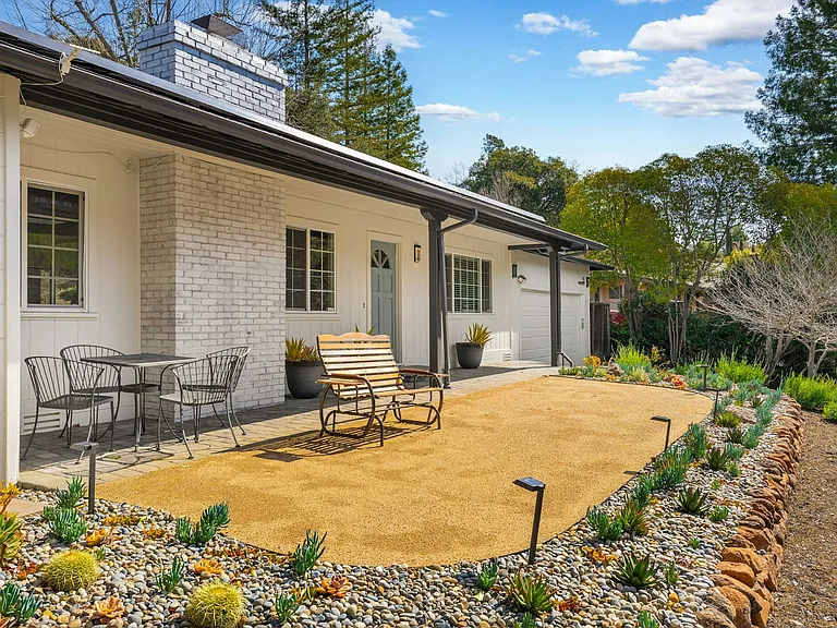 Beautifully xeriscaped front yard with relaxing views on a quiet street