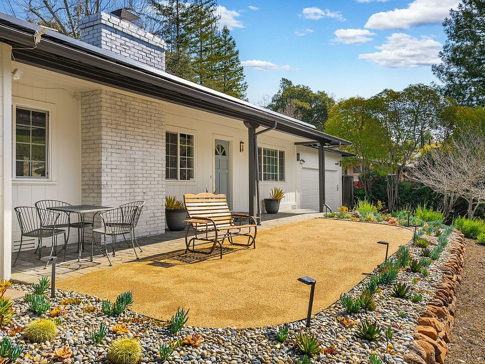 Beautifully xeriscaped front yard with relaxing views on a quiet street